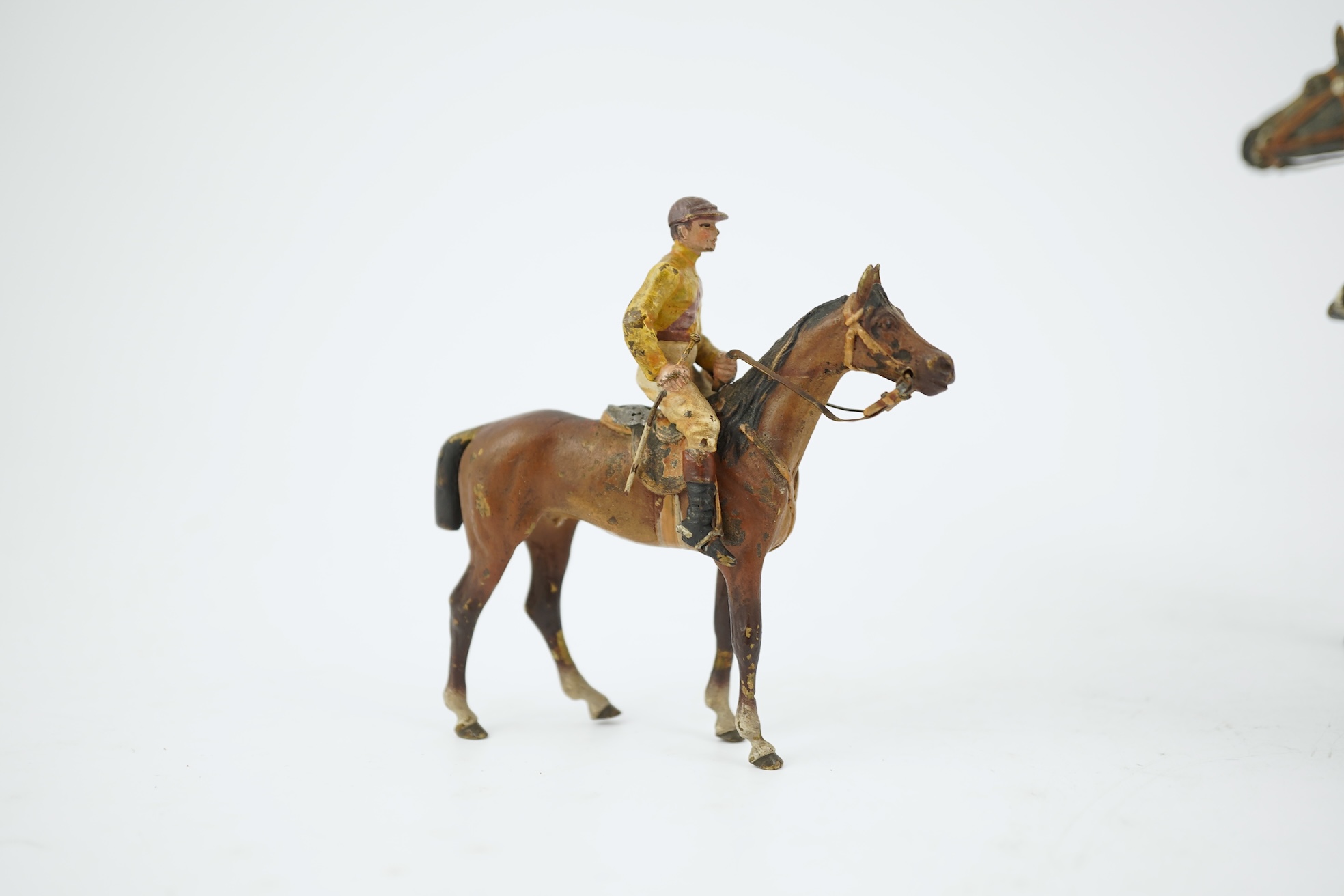 Two Austrian cold-painted bronze figures groups of jockeys on racehorses, early 20th century